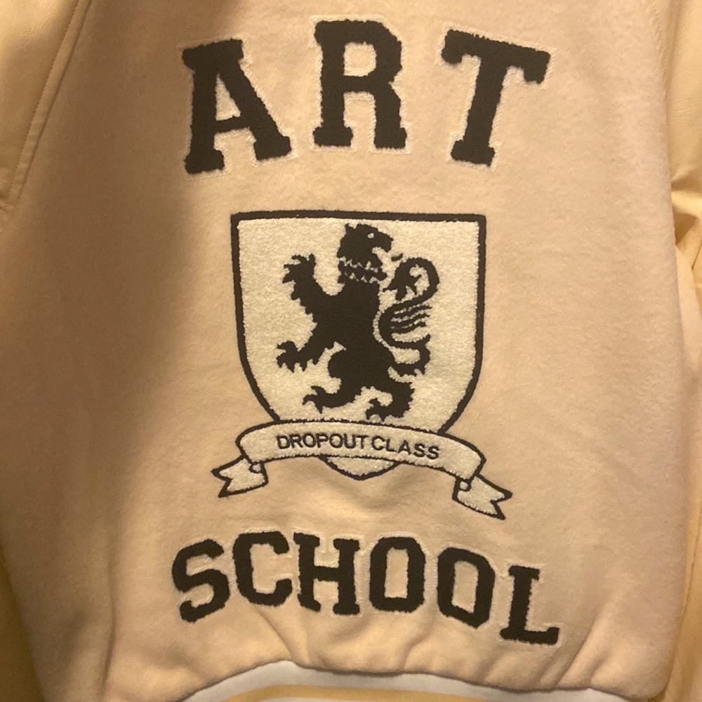 Large Letterman style jacket, color is nude.
